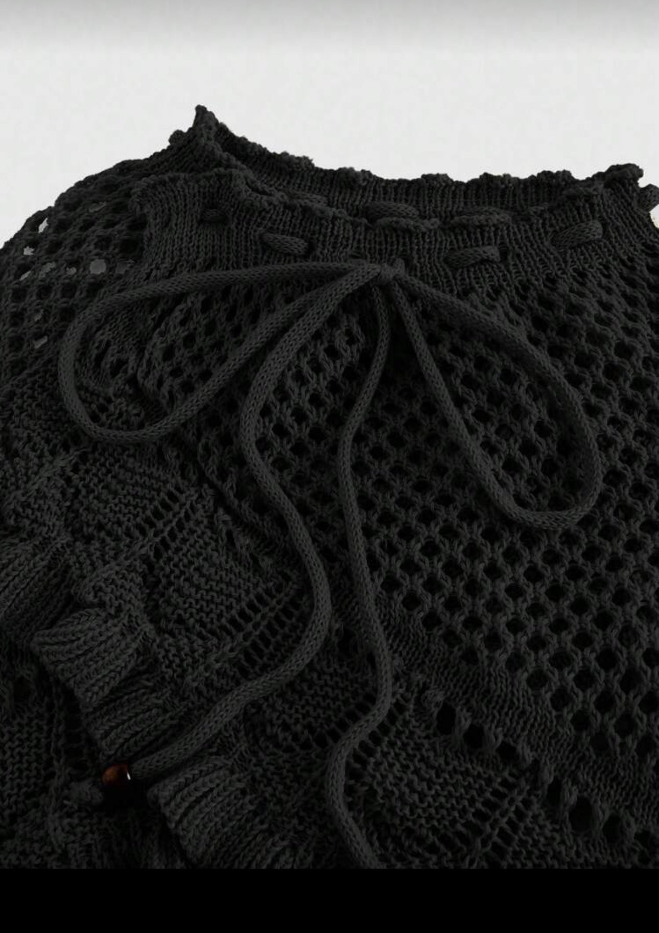 Falda corta tejida de dama.