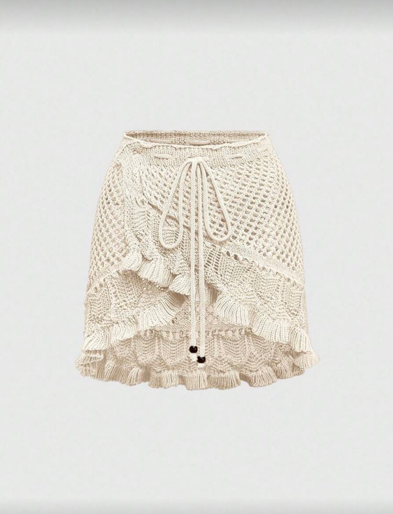 Falda corta tejida de dama.